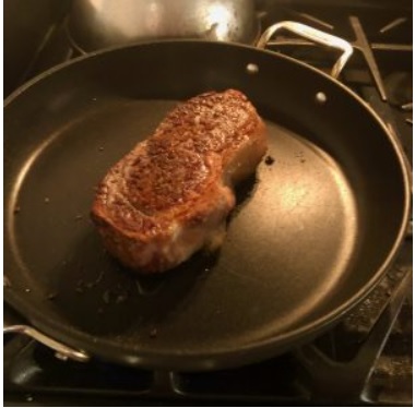 cooking steak in a nonstick pan
